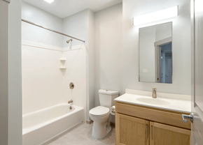 Northampton apartment for rent - A white bathroom with a toilet, sink, and bathtub.