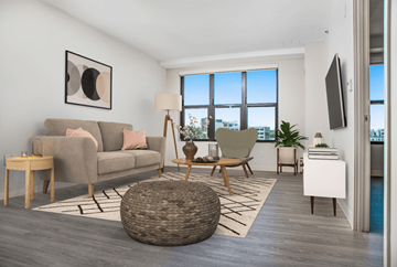Boston apartment for rent - a living room with a couch and a chair and a window