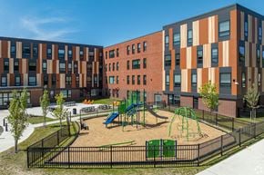 Cleveland apartment for rent - a playground in a courtyard in front of a building
