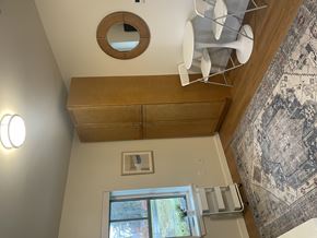 Amherst apartment for rent - A kitchen with a window and a rug hanging on the wall.