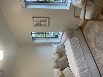 Amherst apartment for rent - A living room with a couch and a picture frame on the wall.