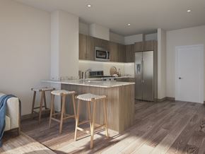Chicago apartment for rent - a kitchen with a marble counter top and three stools