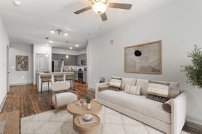 Myrtle Beach apartment for rent - A living room with a couch, chairs, and a coffee table at The Parker Myrtle Beach, Myrtle Beach, SC