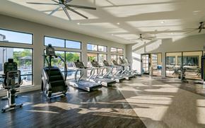 Smyrna apartment for rent - Gym with big windows and cardio equipment at The Eddy at Riverview, Georgia, 30126