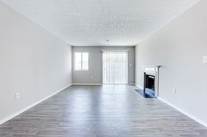 Stone Mountain apartment for rent - A spacious living room with a fireplace and a window with blinds.