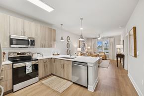 Santa Rosa Beach apartment for rent - A modern kitchen with wooden cabinets and stainless steel appliances.at The Beacon at 331 Apartments, Santa Rosa Beach, FL