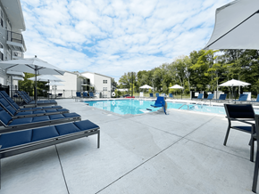 Concord apartment for rent - A pool area with sun loungers at Emery Village, Concord, NC