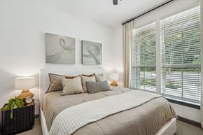 Myrtle Beach apartment for rent - a bedroom with a bed and two paintings on the wall at The Leo Myrtle Beach, Myrtle Beach, SC, 29579