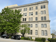 Columbia apartment for rent - A large building with a lot of windows is in front of a tree.