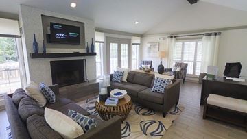 Smyrna apartment for rent - A living room with a fireplace and a television on the wall.