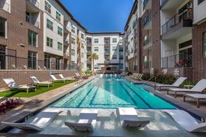 Austin apartment for rent - Outdoor pool with Apartment Building View at The Monroe Apartments, Austin, TX, 78741