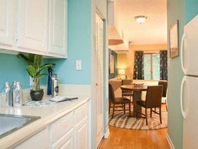 Durham townhouse for rent - White kitchen at Emory Woods Apartments, Durham, NC, 28205.