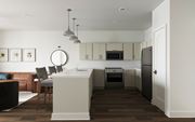 Raleigh apartment for rent - A modern kitchen with a brown wooden floor and white walls at The SoHo Luxury Apartments, Raleigh