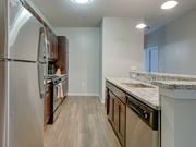 Columbia apartment for rent - A kitchen with a refrigerator, oven, and sink.
