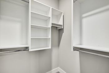 Empty white shelves in a room.