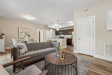 Bluffton apartment for rent - A living room with a grey couch and a coffee table.