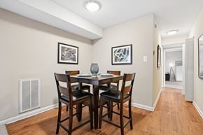Charleston apartment for rent - A dining room with a table and chairs.