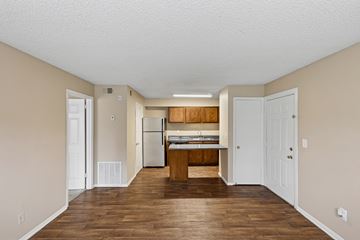 Antioch apartment for rent - A kitchen with white cabinets and a wooden island.