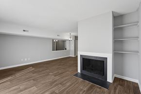 Durham townhouse for rent - A modern living room with a fireplace and wooden flooring.