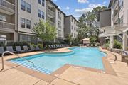 Atlanta apartment for rent - A large swimming pool surrounded by apartment buildings at Union Eleven Apartments, Atlanta, GA