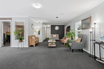 Charlotte apartment for rent - A living room with a grey carpet and furniture.