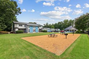 Marietta apartment for rent - A park with a playground and picnic tables at The Taylor, Marietta, GA.