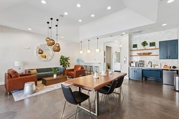Wilmington apartment for rent - A modern living room with a dining table and chairs.