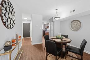 Durham townhouse for rent - A dining room with a round table and chairs.