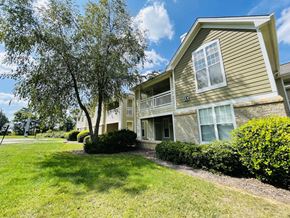 Burlington apartment for rent - House with a lawn and trees in front of it at The Chase, North Carolina