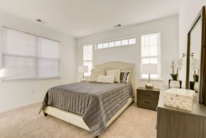 Martinsburg apartment for rent - a bedroom with a bed and two windows