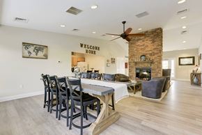 Martinsburg apartment for rent - a dining room with a table and chairs in front of a fireplace