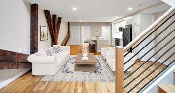 Richmond apartment for rent - A living room with a white couch and a coffee table.