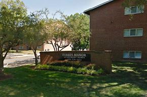 College Park apartment for rent - A Ferris Manor sign is in front of a brick building.