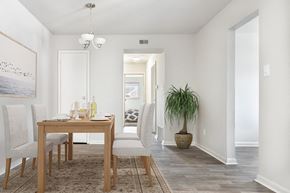 Virginia Beach apartment for rent - a dining room and living room with a table and chairs