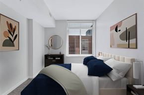 Reston apartment for rent - a bedroom with a large bed and a window