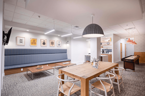 Richmond apartment for rent - a conference room with a table and chairs and a blue couch