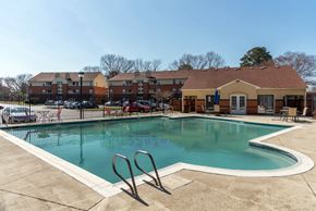 Newport News apartment for rent - the preserve at ballantyne commons community swimming pool with apartment buildings in the background