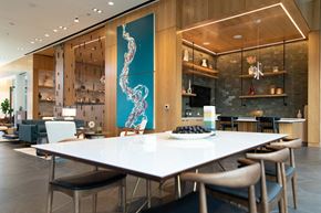 Richmond apartment for rent - a dining room with a white table and chairs and a blue painting on the wall