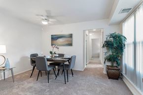 Herndon apartment for rent - a dining room with a table and chairs and a ceiling fan