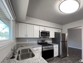 Virginia Beach apartment for rent - a kitchen with granite counter tops and stainless steel appliances