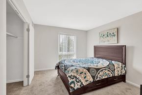 Manassas apartment for rent - a bedroom with a bed and a closet