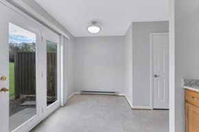 Martinsburg townhouse for rent - an empty room with a door to a yard and a window