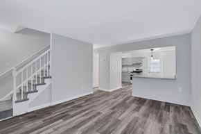 Chesapeake apartment for rent - the living room and kitchen of a renovated house with hardwood floors