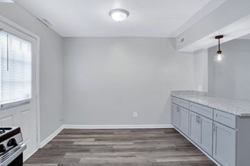 Chesapeake apartment for rent - A kitchen with a stove top oven and a counter top.