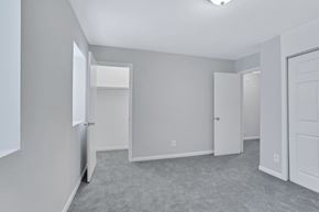 Chesapeake apartment for rent - an empty bedroom with white doors and white walls