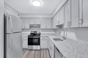 Portsmouth apartment for rent - the preserve at ballantyne commons spacious kitchen with granite counter tops and white cabinets