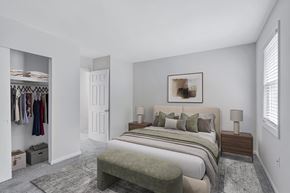 Hopewell townhouse for rent - A bedroom with a large bed and a clothing closet.