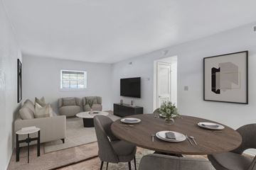 Charlottesville apartment for rent - A modern dining room with a round table set for two.