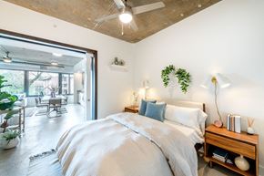 Falls Church apartment for rent - a bedroom with a bed and a ceiling fan