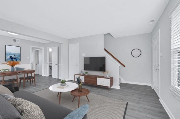 Richmond townhouse for rent - a living room with gray walls and a gray couch